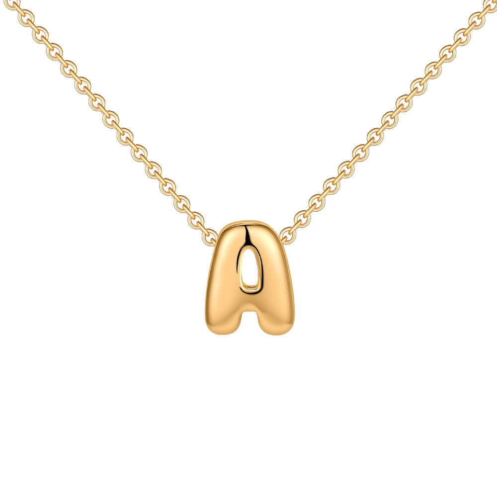 Gold necklace with a letter 'A' pendant on a white background