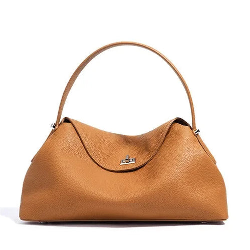 Brown leather handbag on a white background