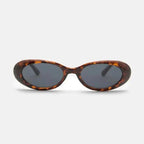 Sunglasses with tortoiseshell frame and dark lenses on a white background