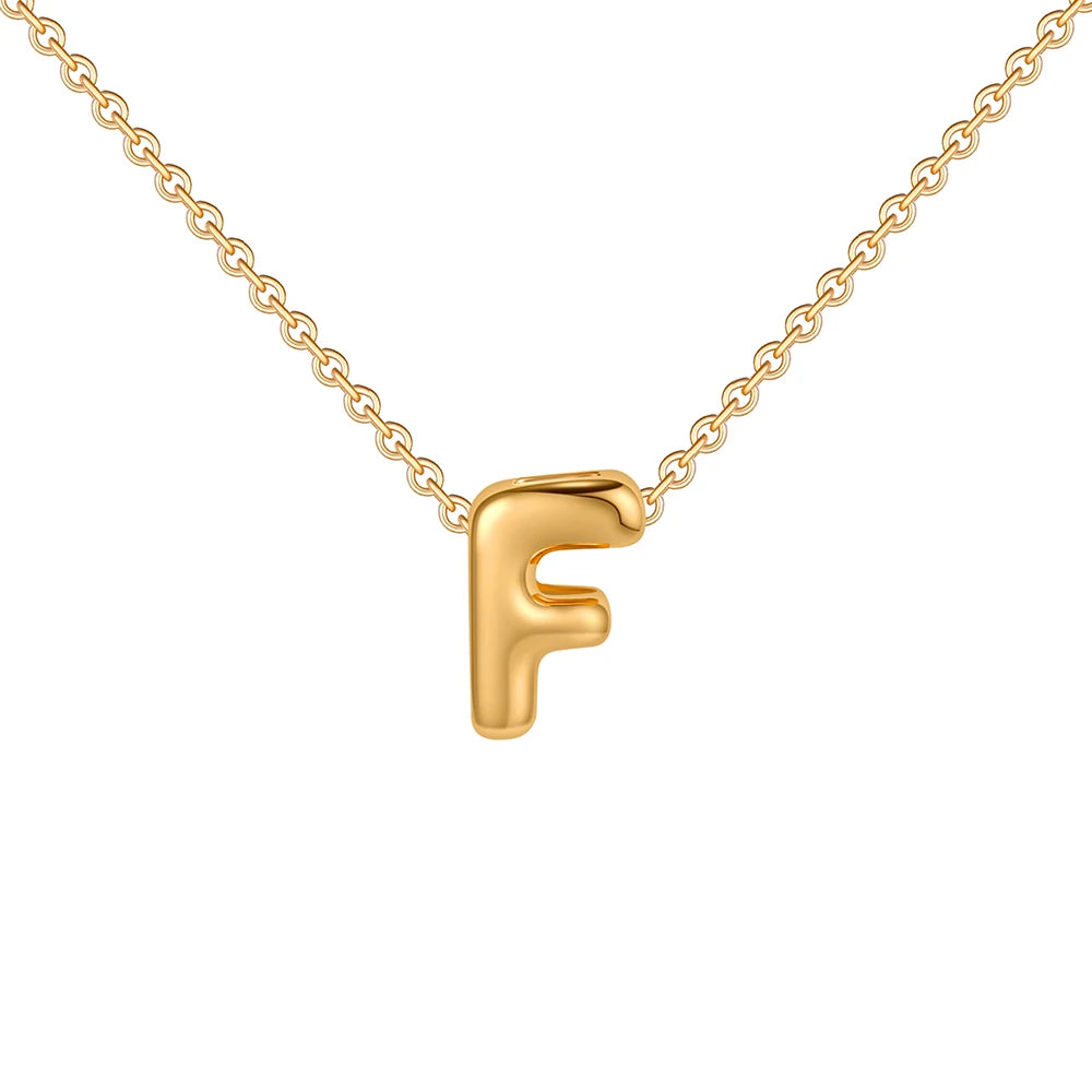 Gold necklace with a letter 'F' pendant on a white background