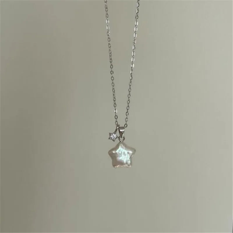Star-shaped pendant necklace on a plain background
