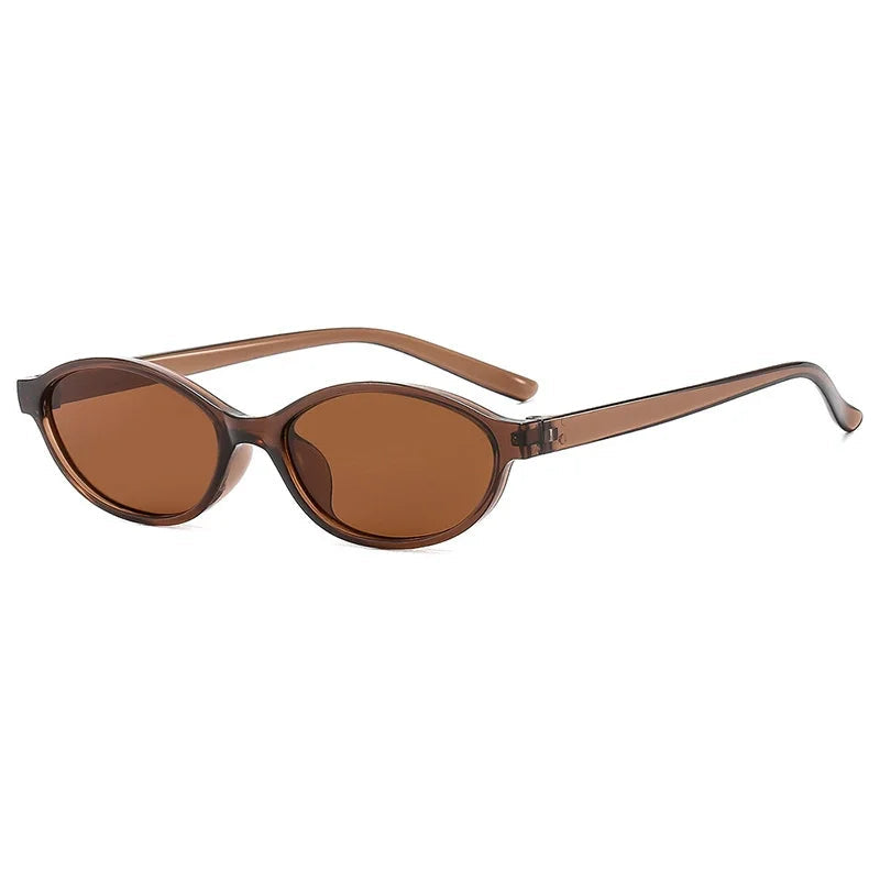 Sunglasses with brown lenses and light brown frame on a white background