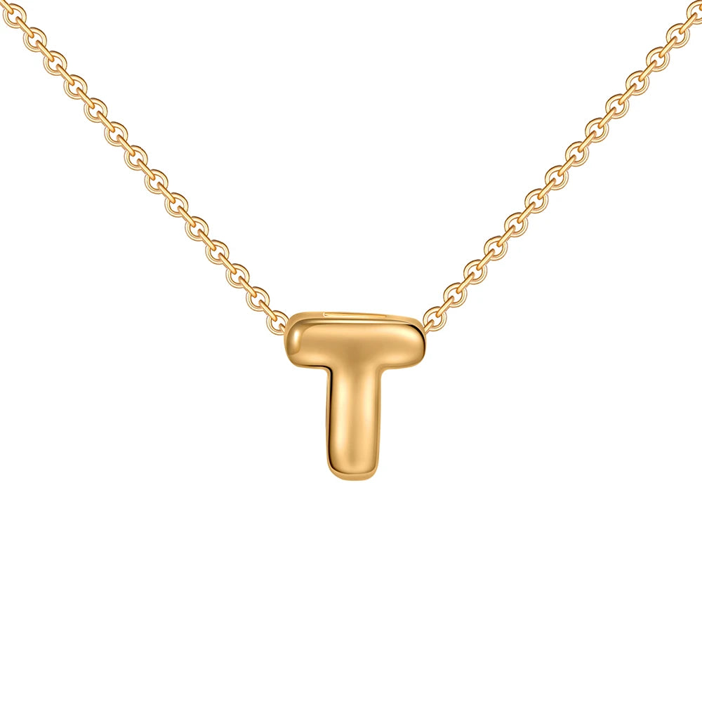 Gold necklace with a letter 'T' pendant on a white background