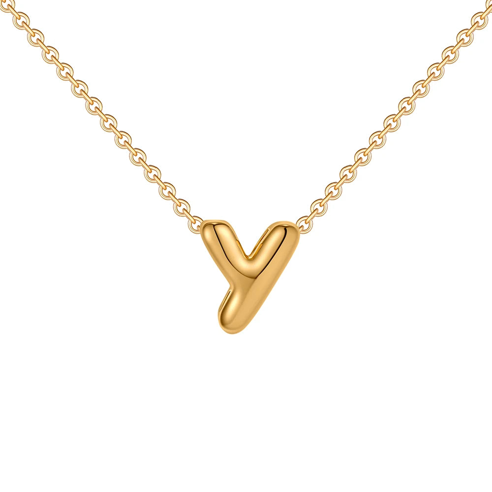 Gold necklace with a V-shaped pendant on a white background