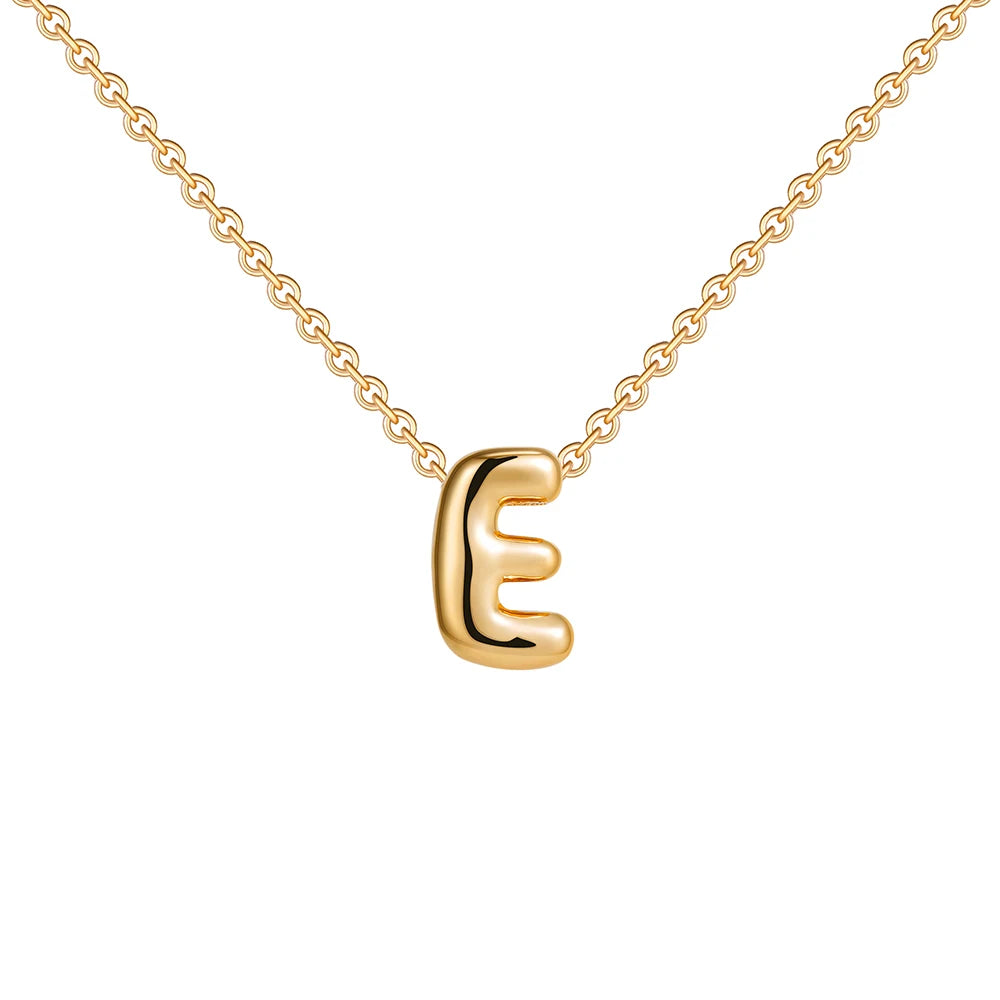 Gold necklace with a letter 'E' pendant on a white background