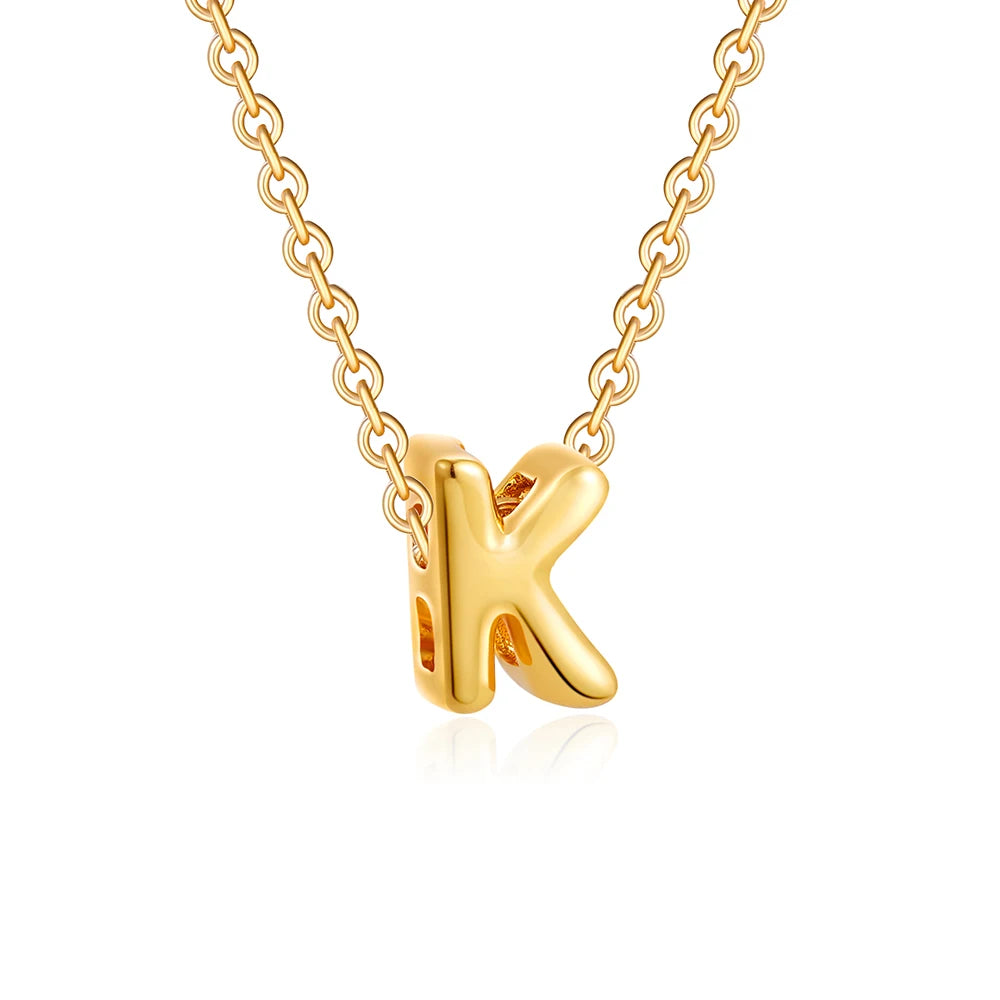 Gold necklace with a 'K' pendant on a white background