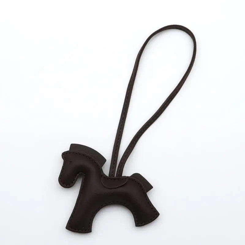 Brown horse-shaped keychain on a white background