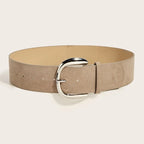 Beige belt with a silver buckle on a light beige background