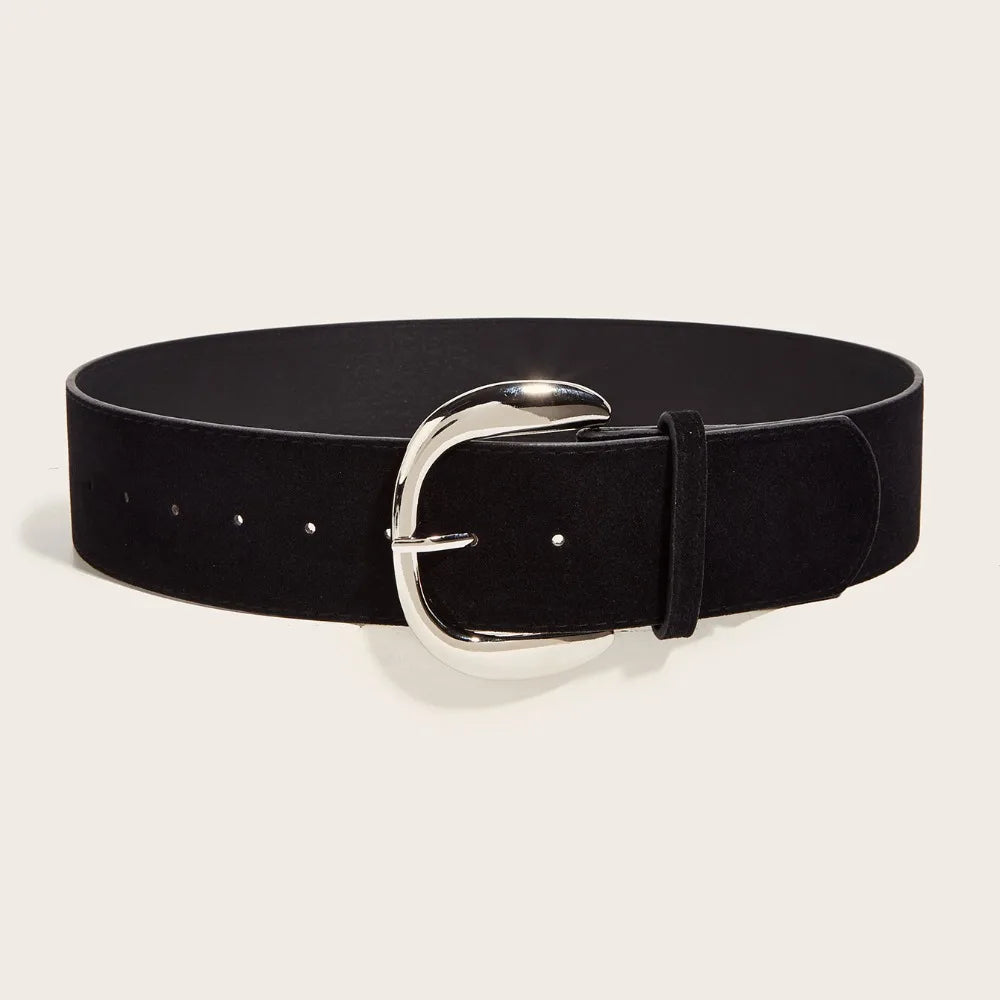 Black belt with a silver buckle on a light beige background