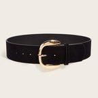 Black belt with a gold buckle on a beige background