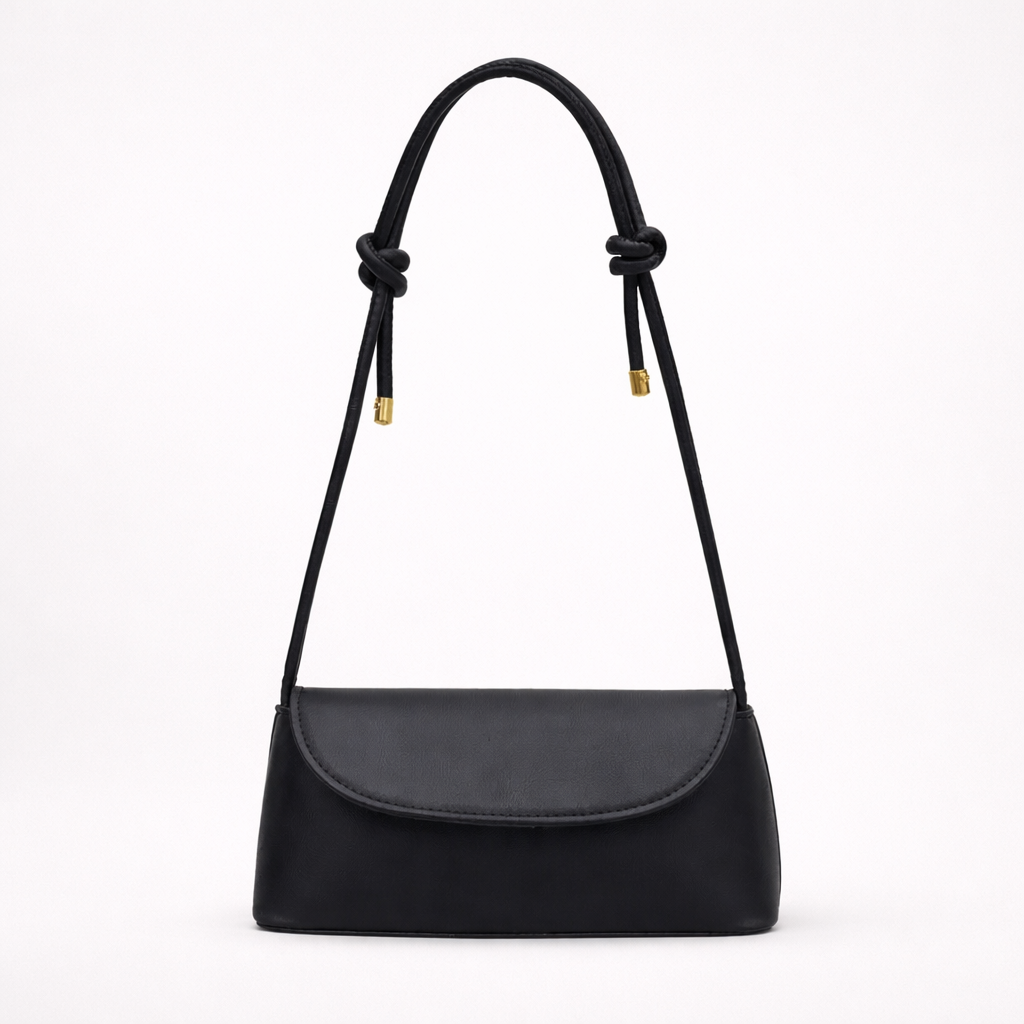 Black shoulder handbag with a knotted strap on a white background