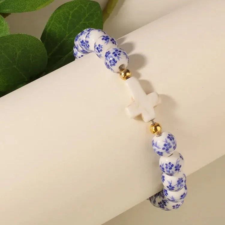 Bracelet with blue floral pattern on a white background