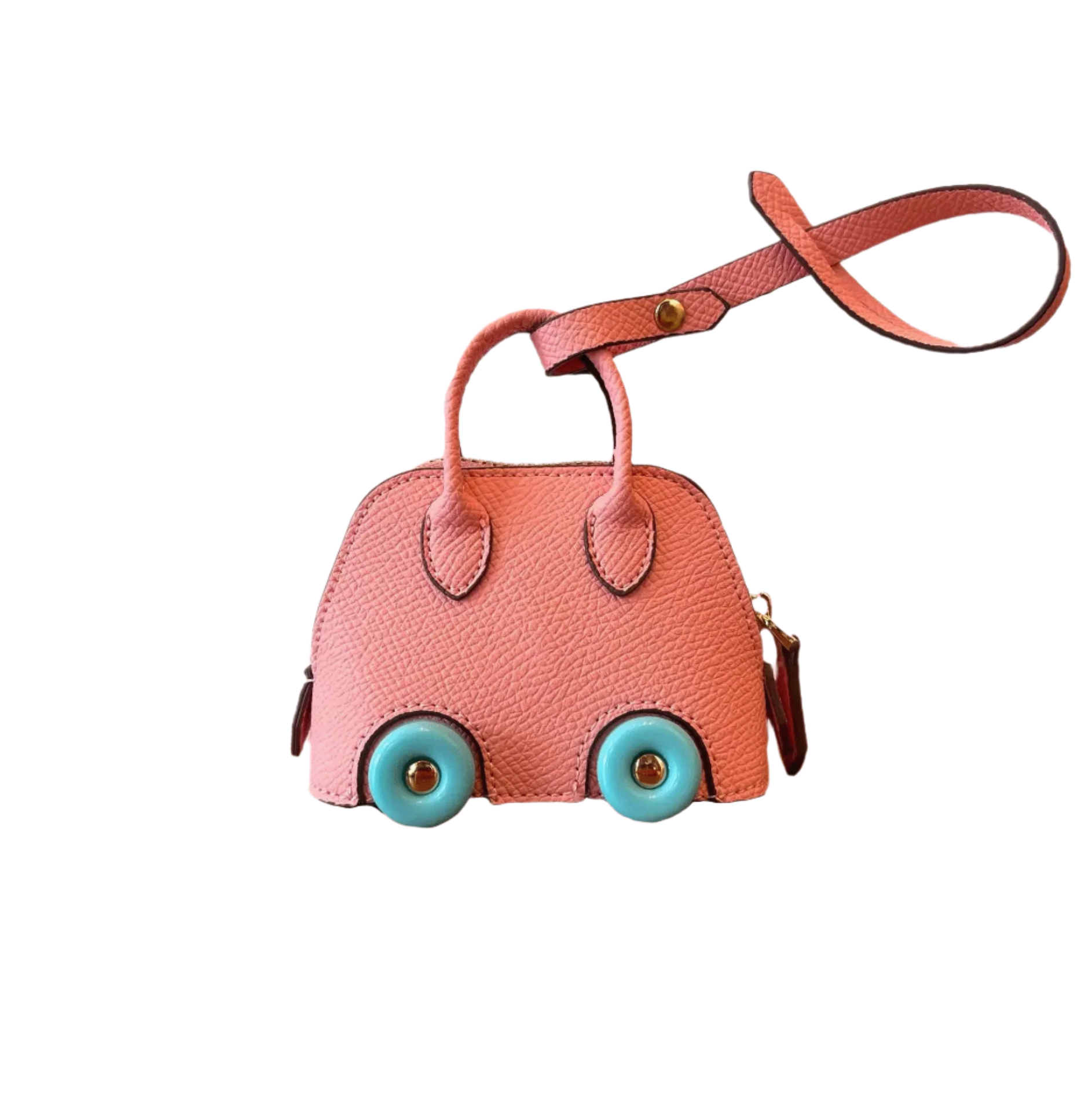 Pink leather car shape bag charm with blue wheels and top handle. Handbag accessory and keychain.