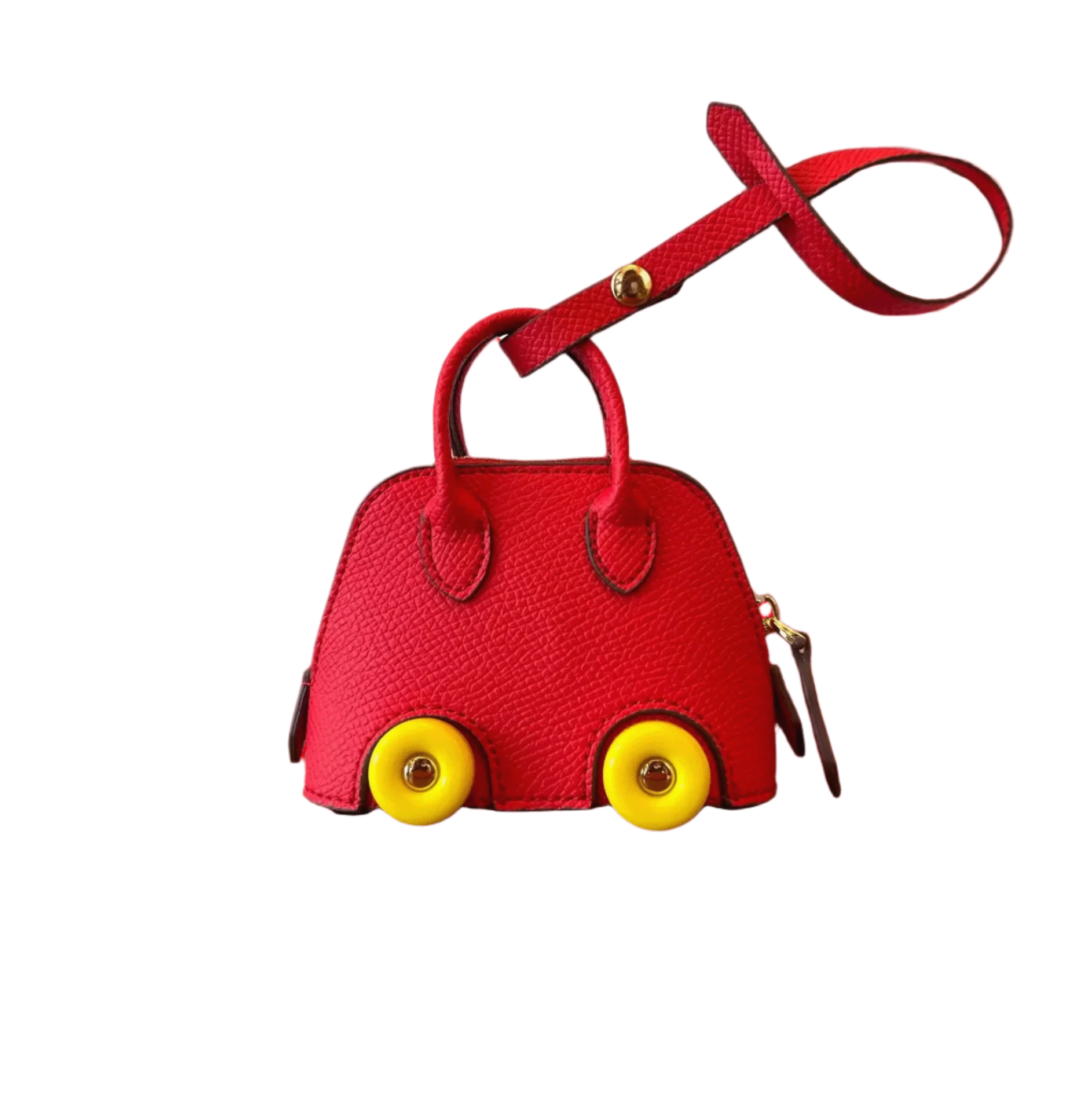 Red leather car shape bag charm with yellow wheels and top handle. Handbag accessory and keychain.