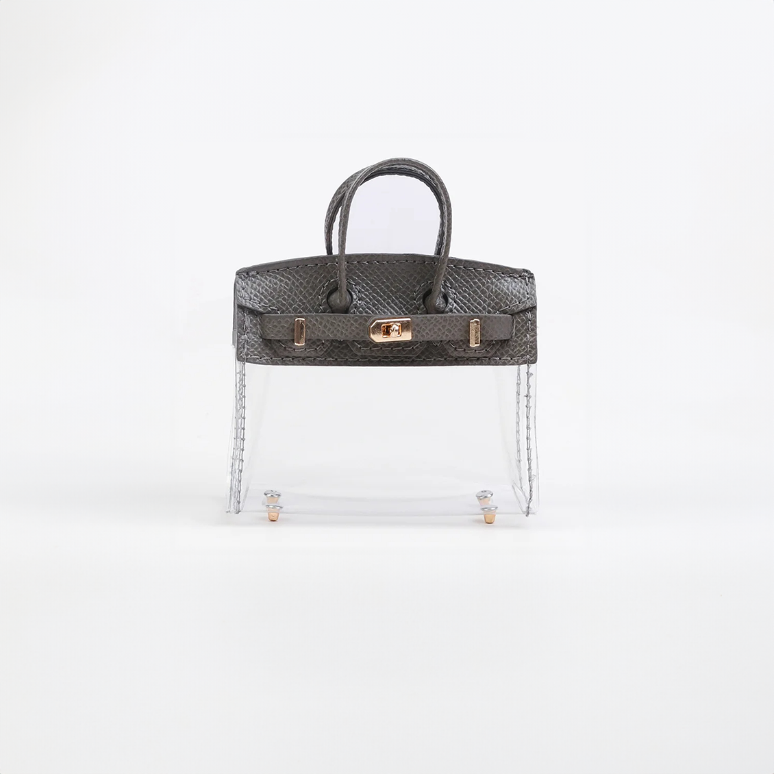 Gray top handle and base, clear panel structured mini bag charm with gold-tone hardware.