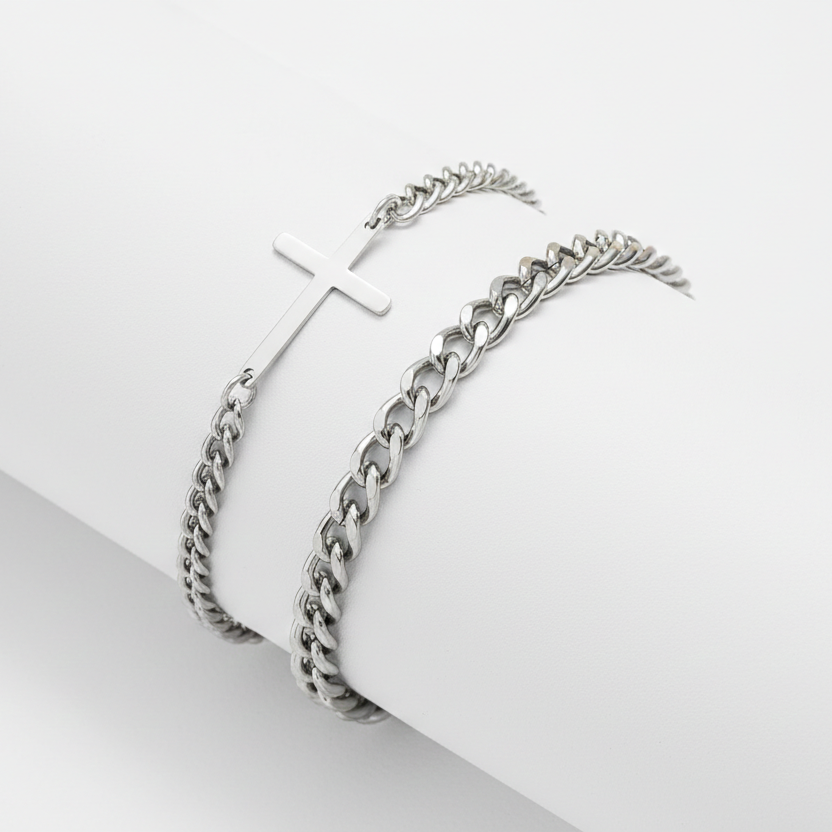 Pair of silver hoop earrings on a white surface