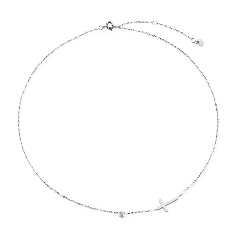 Silver necklace with a cross pendant on a white background
