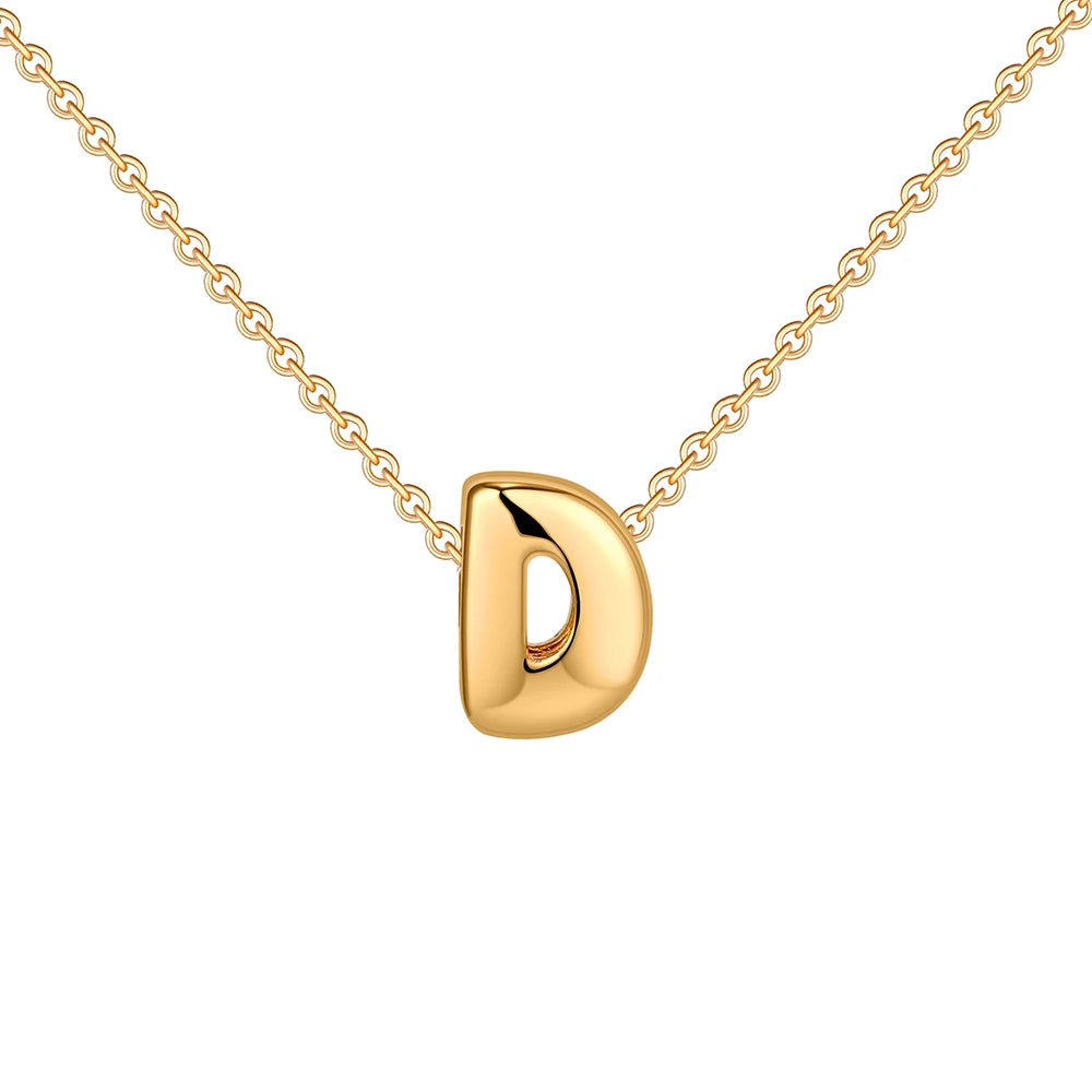 Gold necklace with a 'D' pendant on a white background