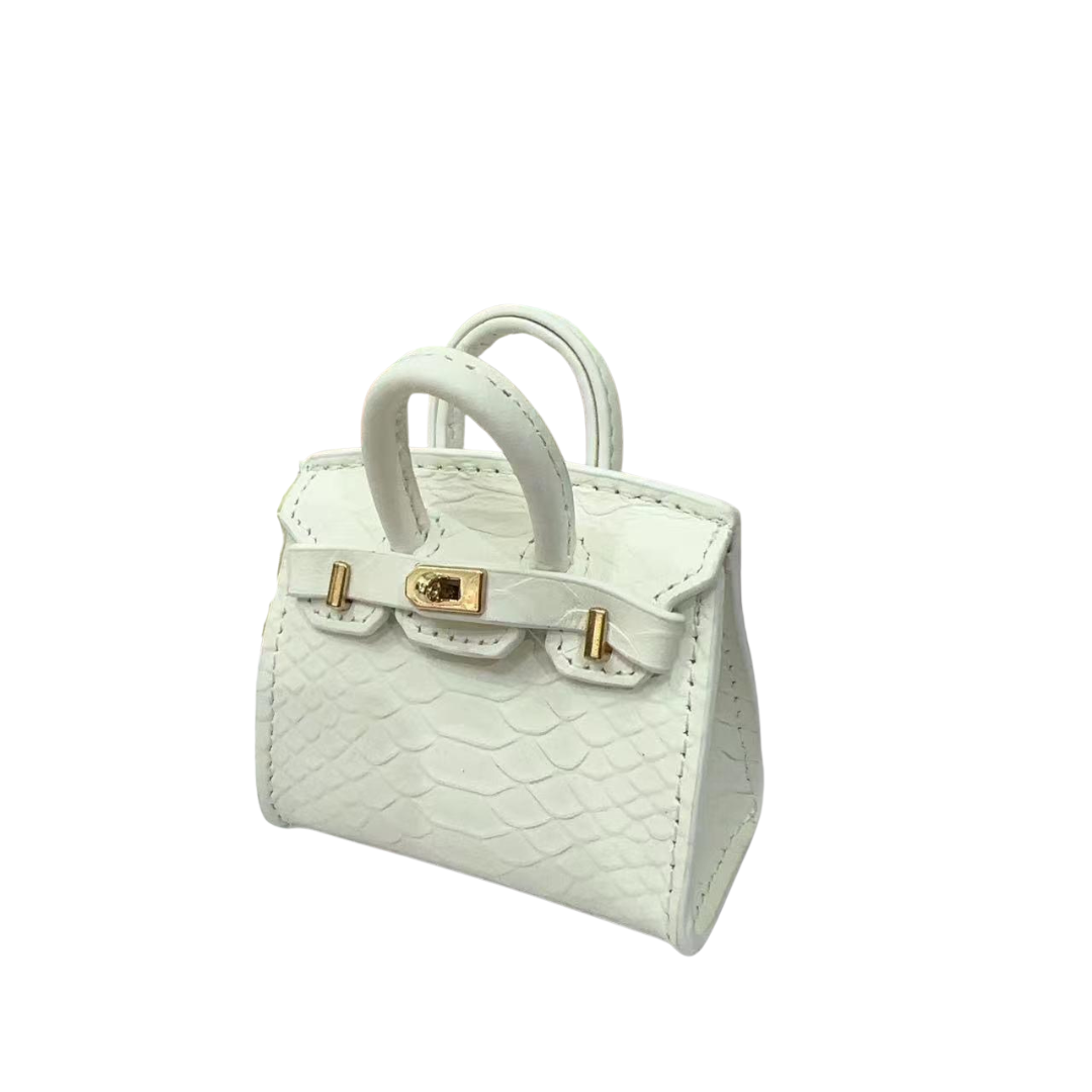 White genuine leather structured charm with matte, classic crocodile embossed texture and top handle.
