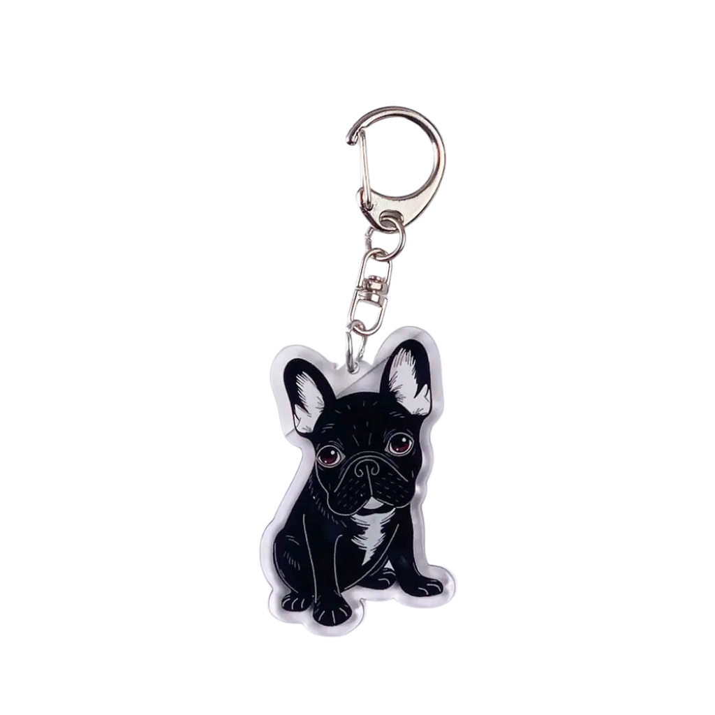 Keychain with a design of a black and white dog on a white background