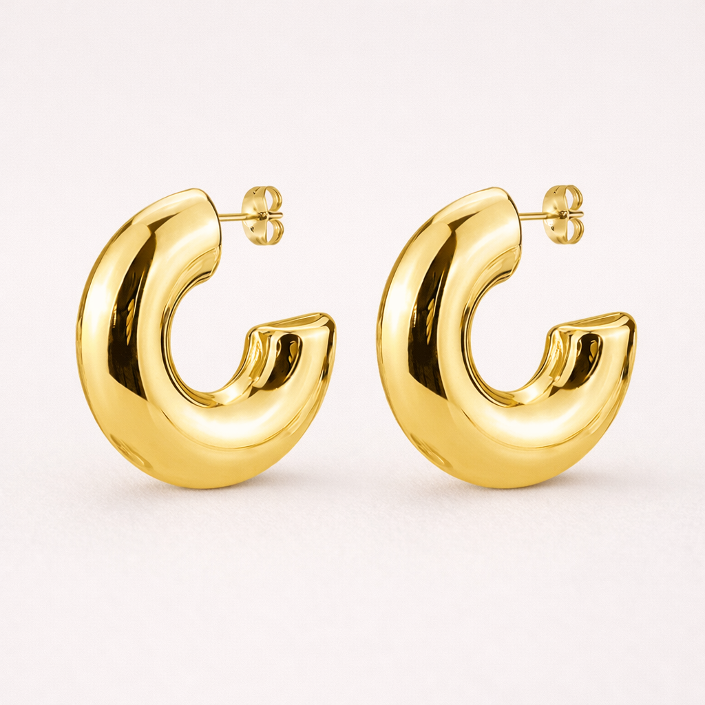 Gold hoop earrings on a white background