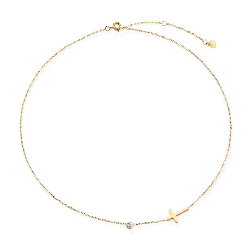 Gold necklace with a cross pendant on a white background