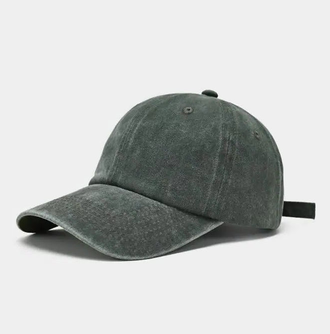 Green denim cap on a light gray background
