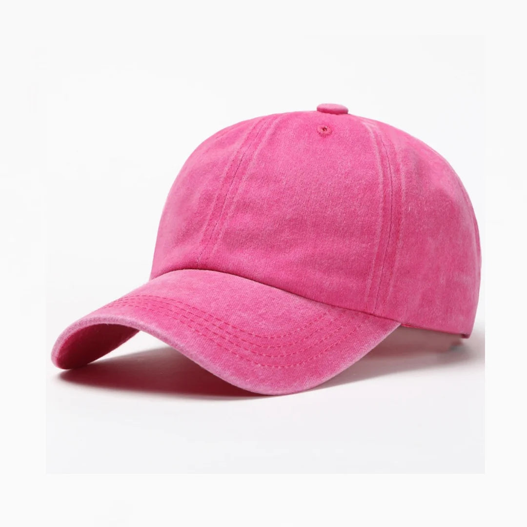 hot pink cap in washed cotton on a white background.