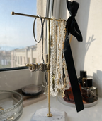 Jewelry stand with jewelry on it