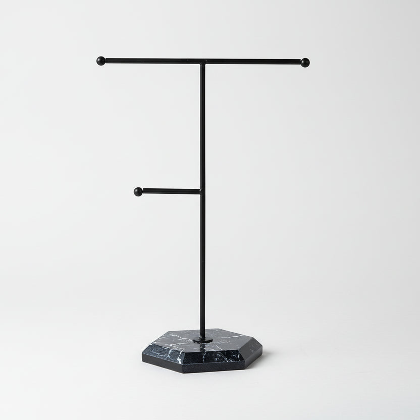 Black freestanding jewelry rack  on a white background