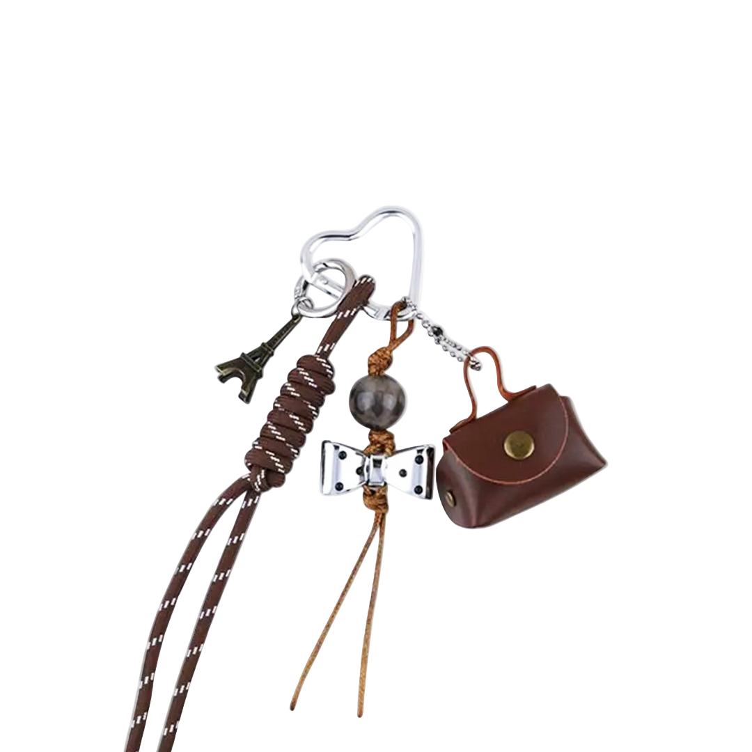 Brown genuine leather coin purse bag charm with snap closure and fold-over flap. Functional mini pouch keychain.