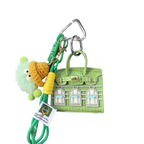 Lime Green leather structured mini bag charm shaped like a house, featuring decorative window panels and a top handle.