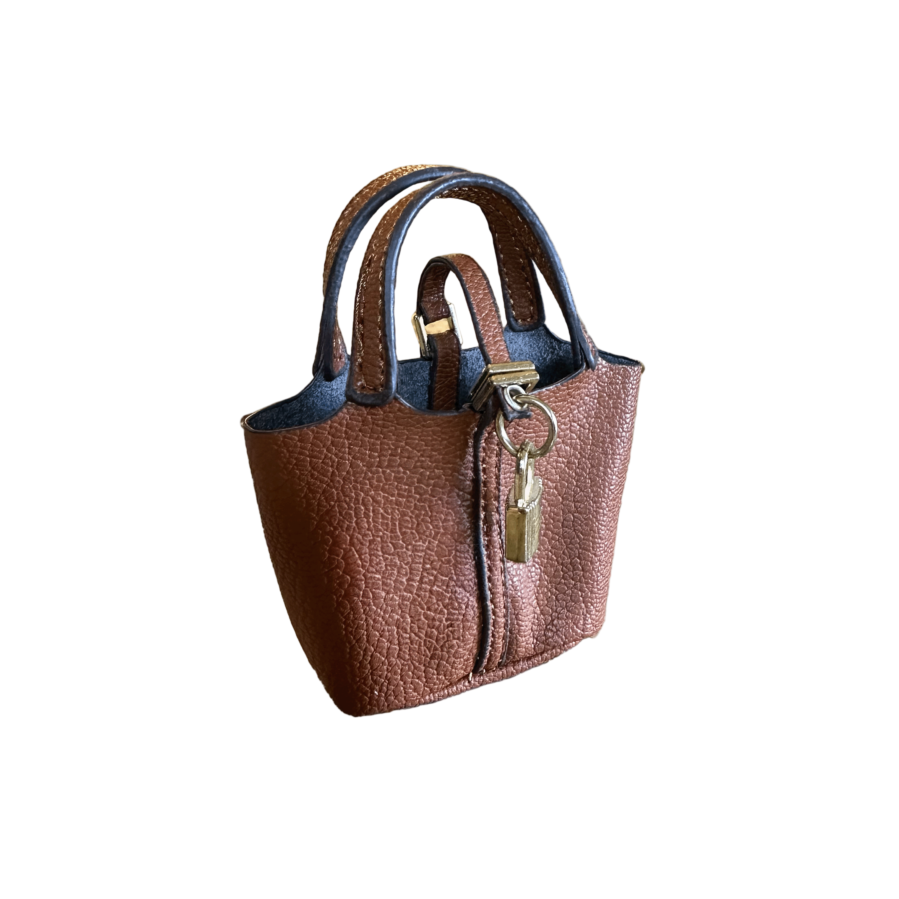 Brown textured mini bag charm leather with blue interior on a light gray background