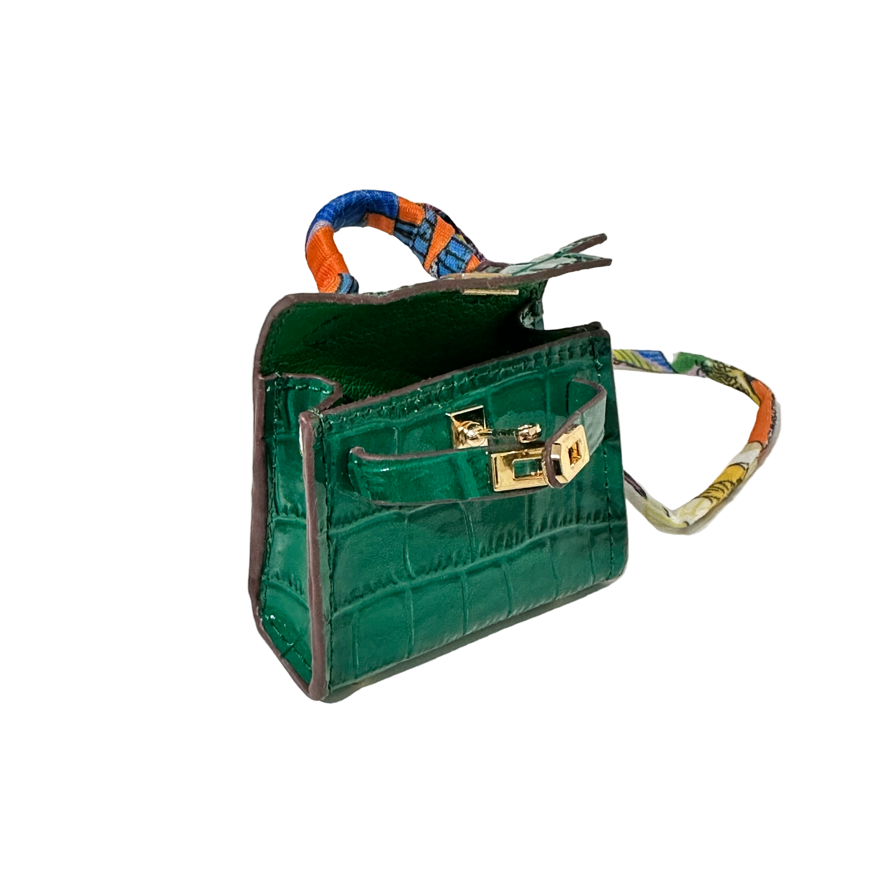 Green mini bag charm handbag with a colorful handle on a white background