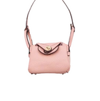 Pink textured leather mini crossbody bag charm with gold-tone twist-lock closure and thin shoulder strap. Keychain and handbag accessory.