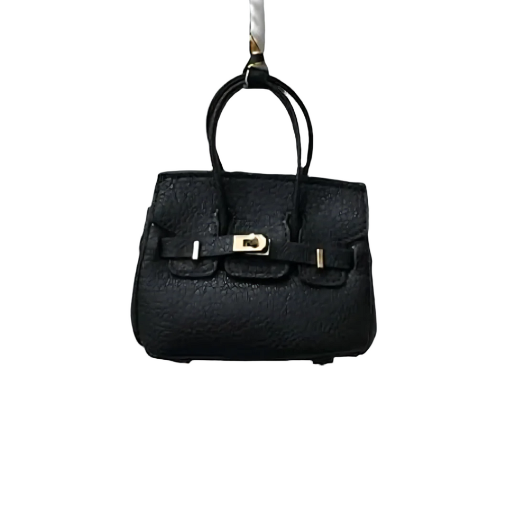 Black genuine leather Mini Purse Iconic Bag Charm with structured shape, top handle, securing straps, and gold-tone padlock.