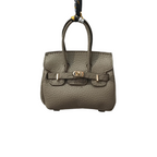 Khaki genuine leather Mini Purse Iconic Bag Charm with structured shape, top handle, securing straps, and gold-tone padlock.