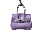 Lavender genuine leather Mini Purse Iconic Bag Charm with structured shape, top handle, securing straps, and gold-tone padlock.
