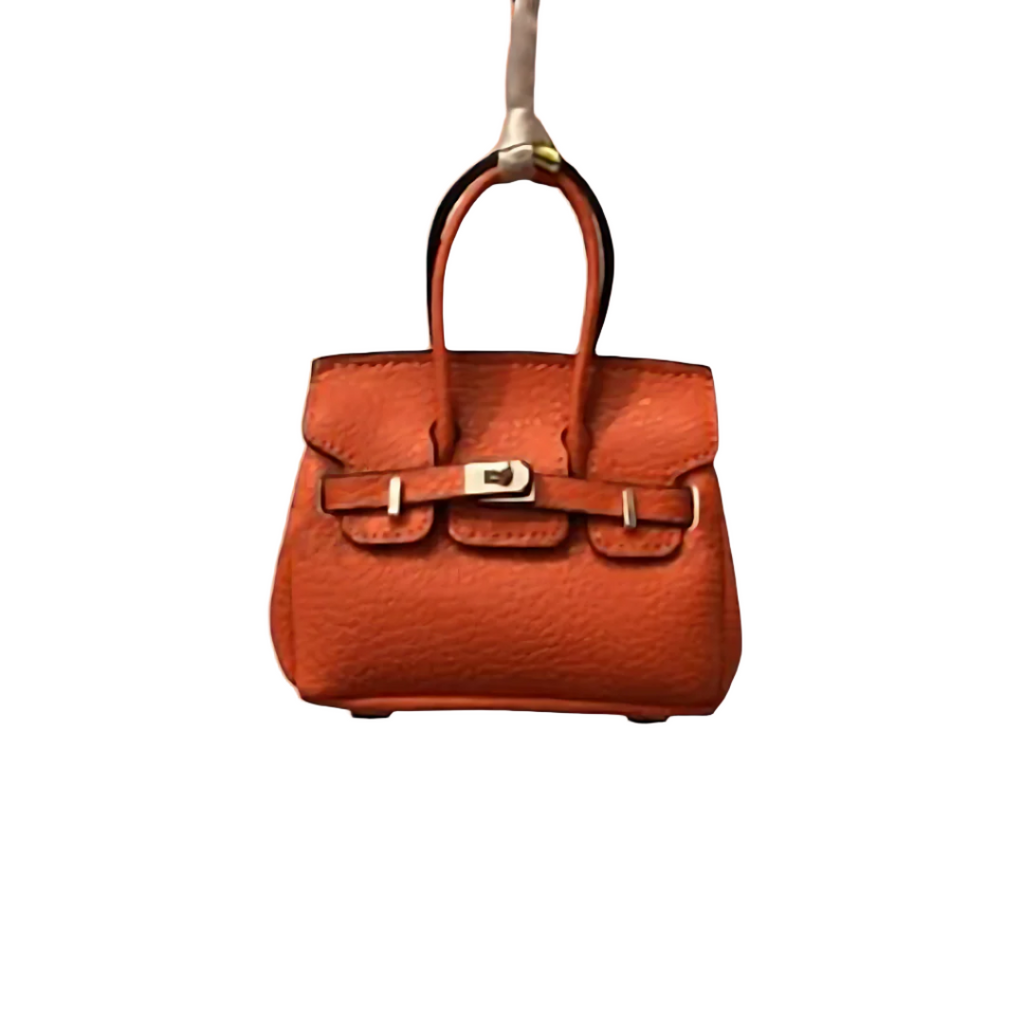 Orange genuine leather Mini Purse Iconic Bag Charm with structured shape, top handle, securing straps, and gold-tone padlock.