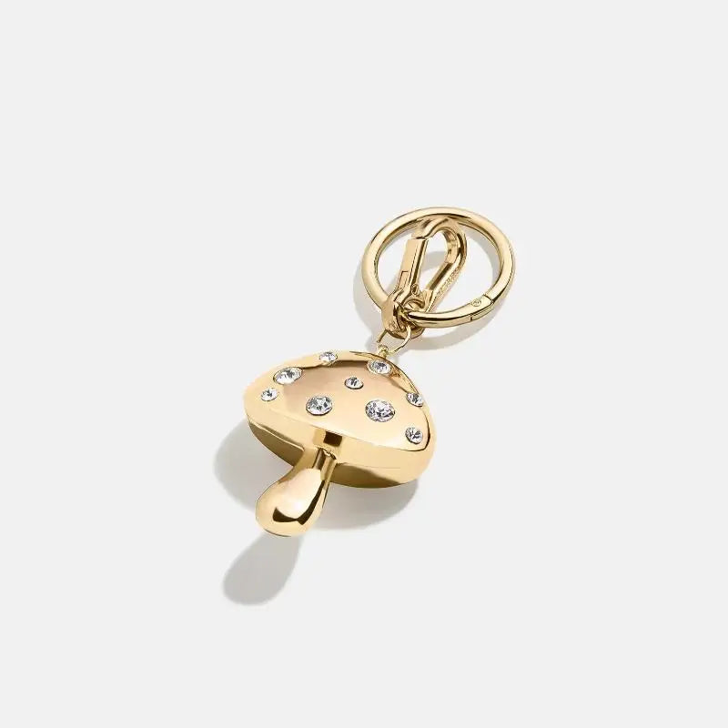 Gold keychain with a heart-shaped padlock design on a white background
