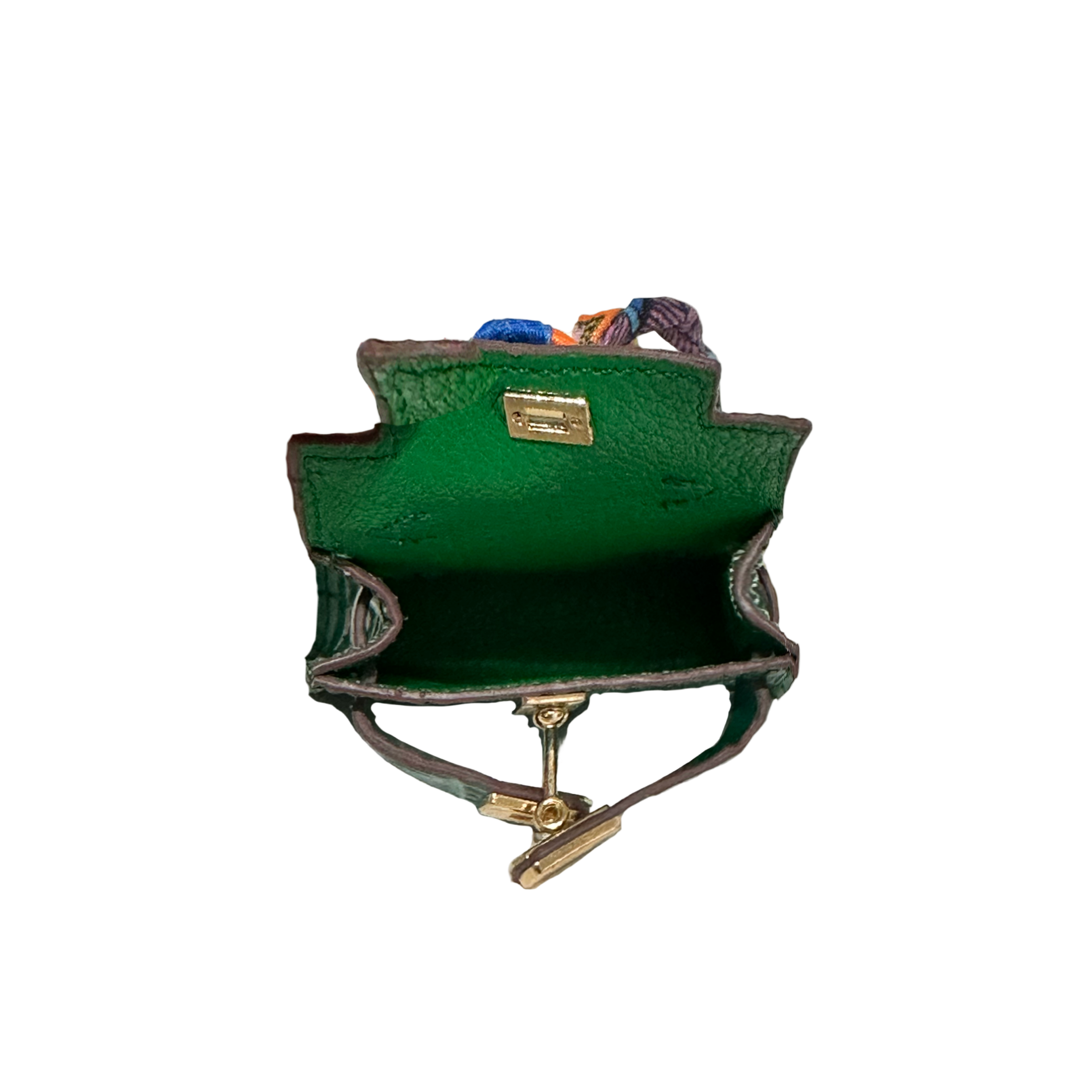 Green mini bag charm details with gold accents on a white background