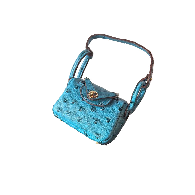Light blue/Teal Ostrich textured mini bag charm with flap closure and small shoulder strap.