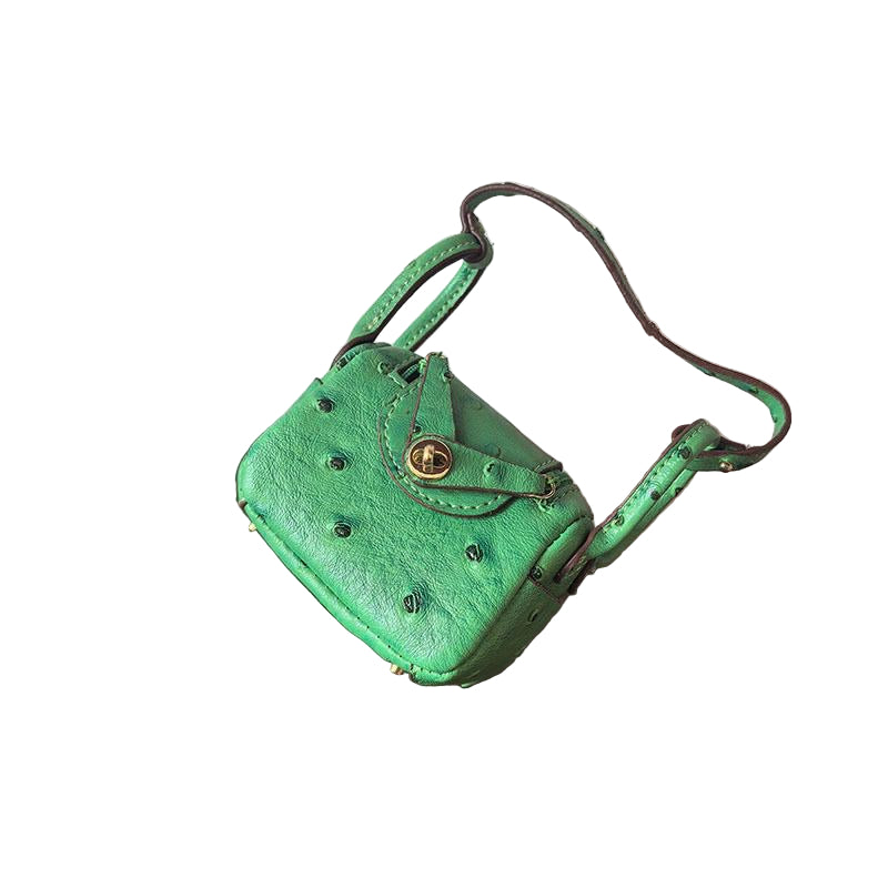 Bright green Ostrich textured mini bag charm with flap closure and small shoulder strap.