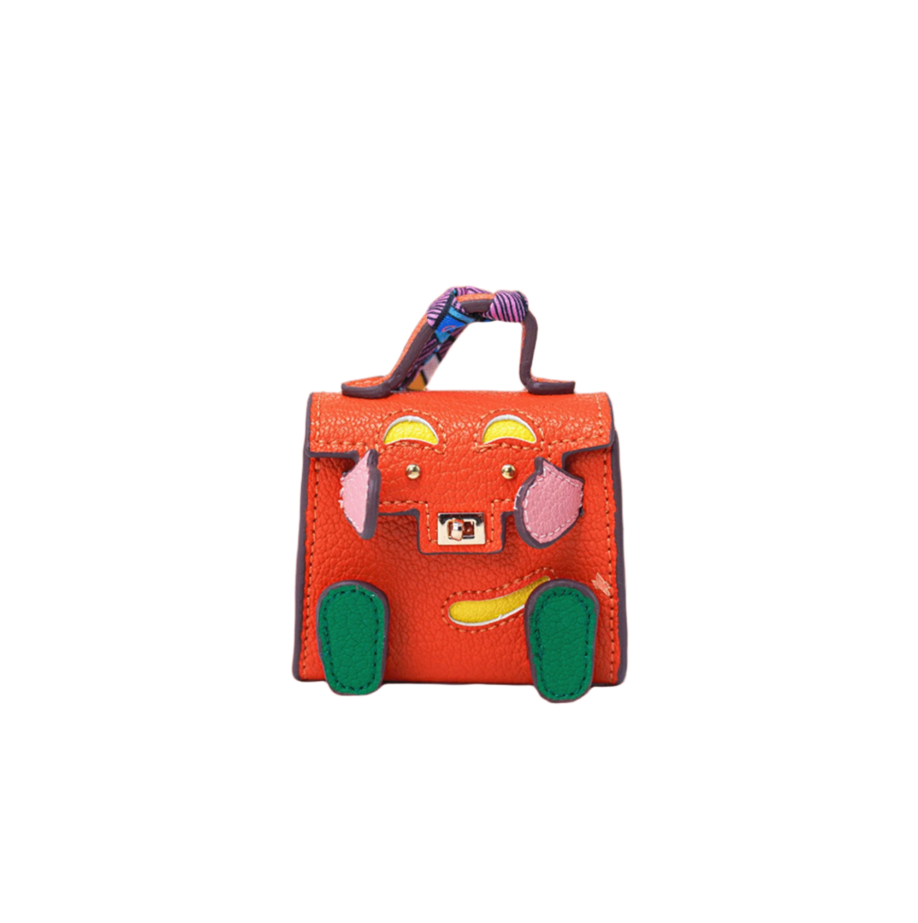 Orange mini leather bag charm with a playful face design made of pink and green patches, yellow accents.