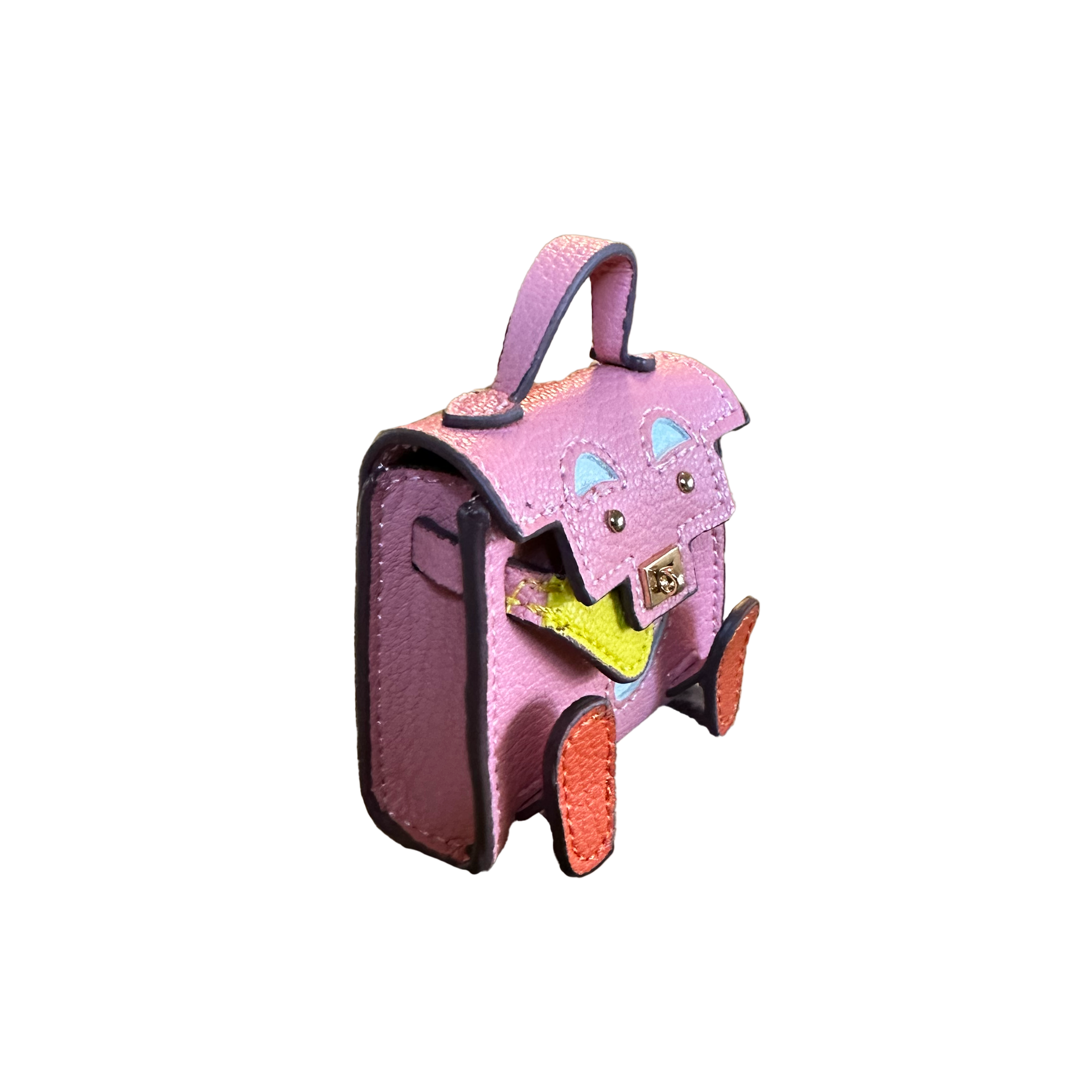 Details of mini bag charm with cute face in pink, showing from the side. 