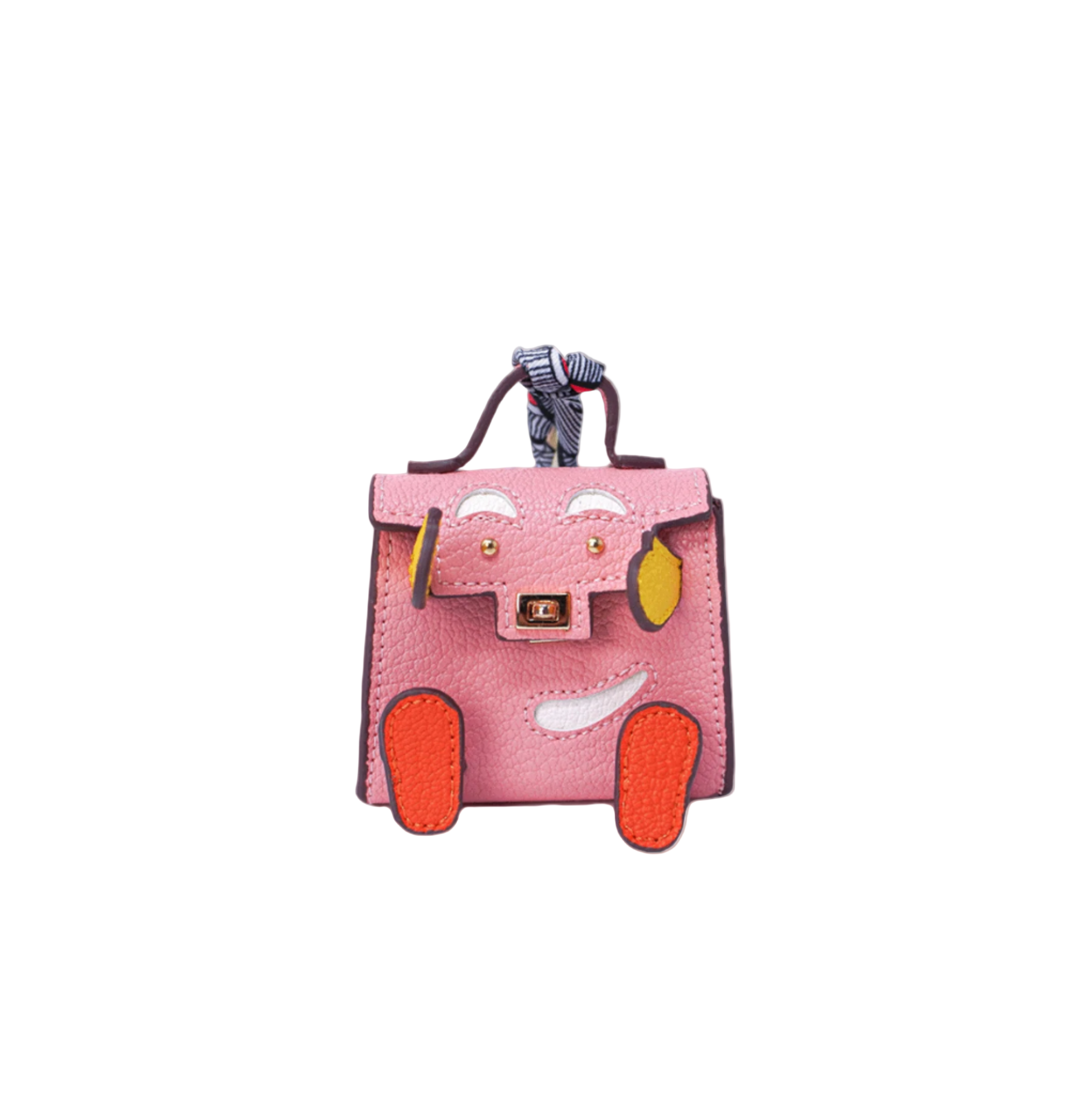 Pink mini leather bag charm with a playful face design made of orange and green patches, white accents.