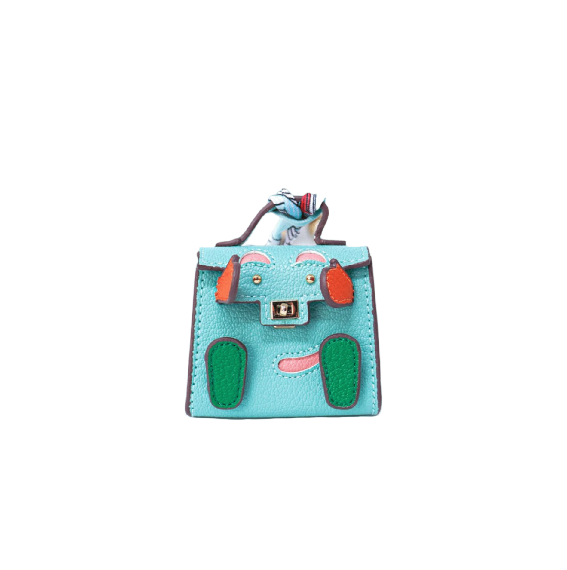 Teal mini leather bag charm with a playful face design made of orange and green patches, pink accents.