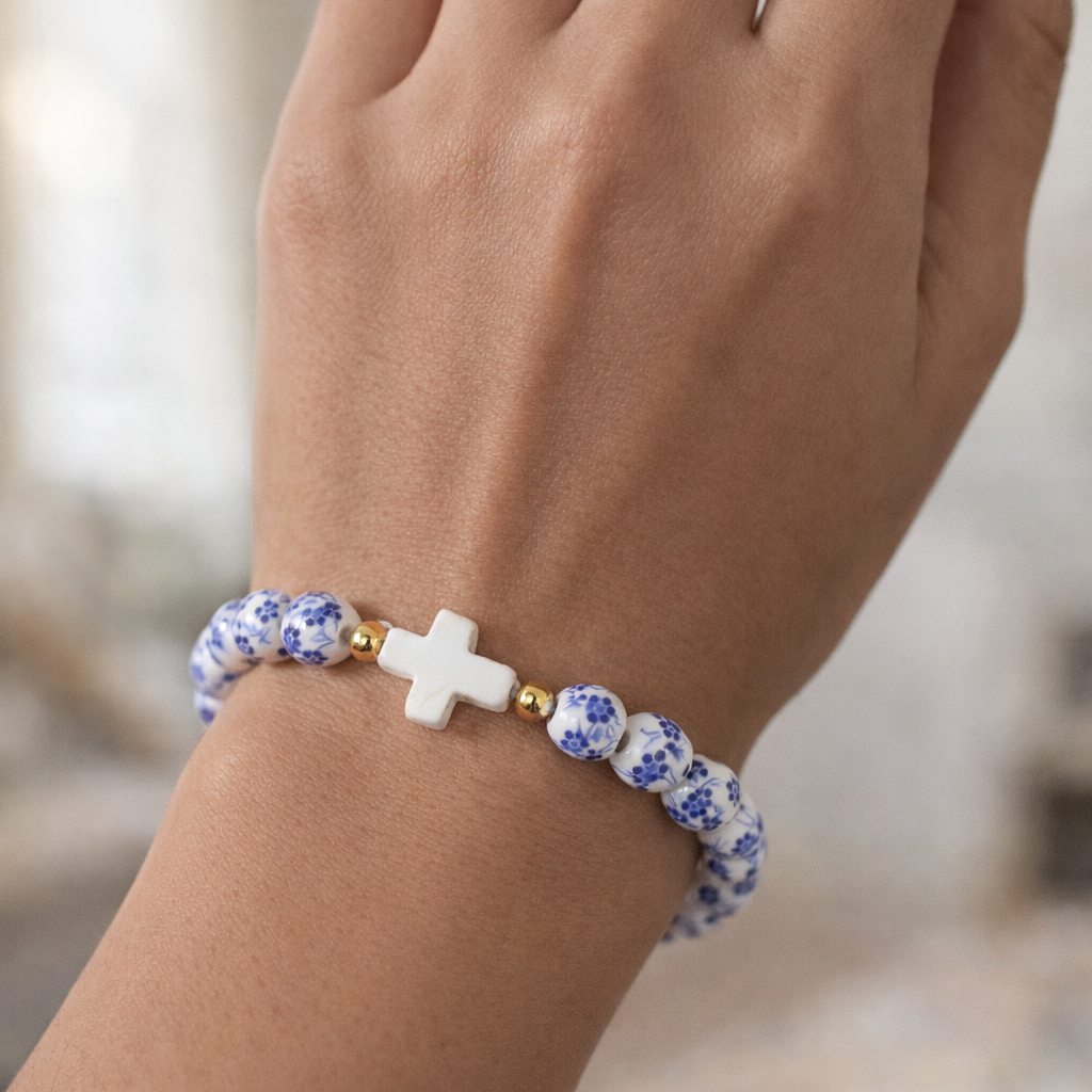 cute bracelet with a cross on it with porcelain beads