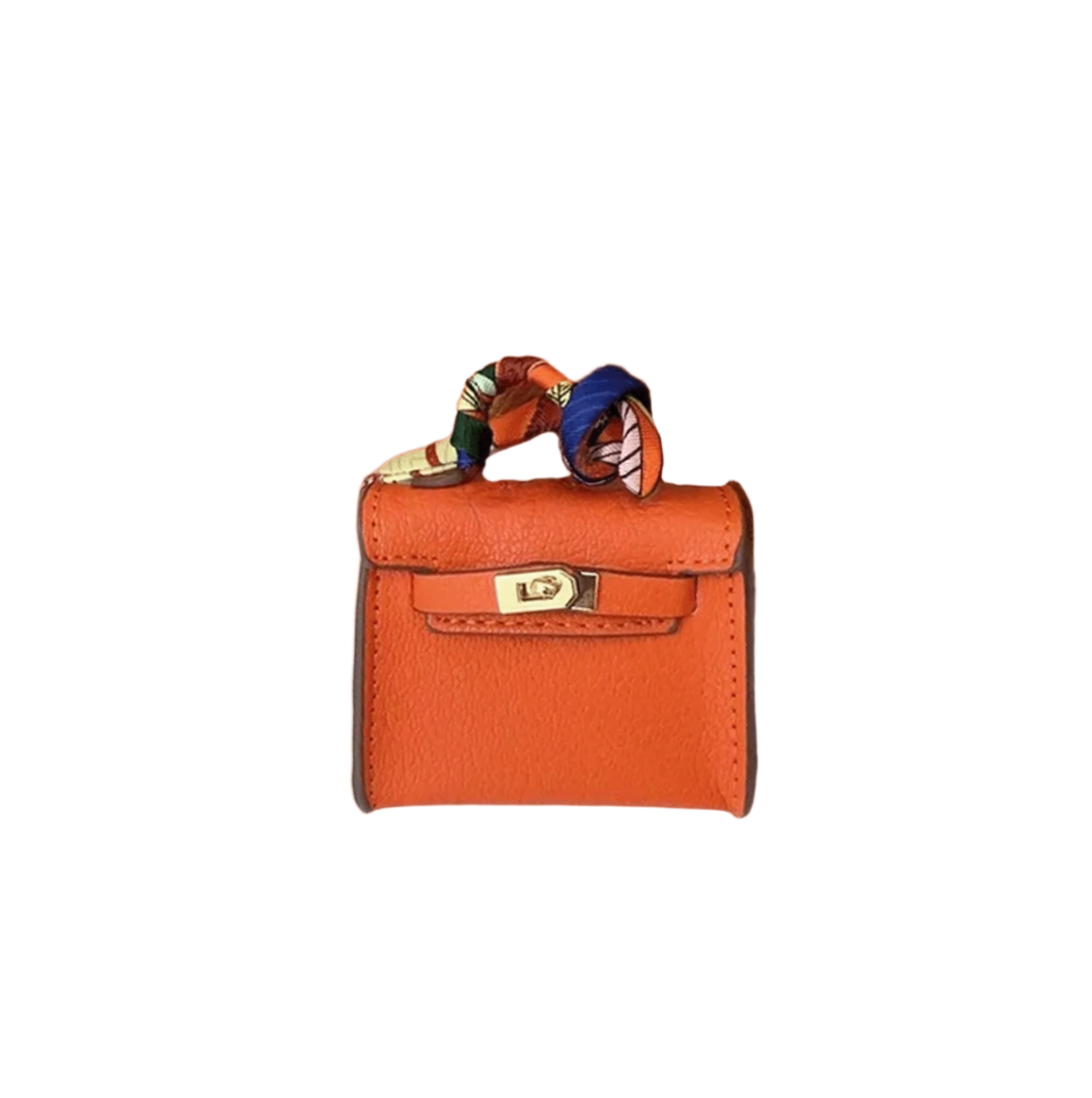 Orange leather mini bag charm with scarf-wrapped handle and flap closure. Handbag accessory and keychain.