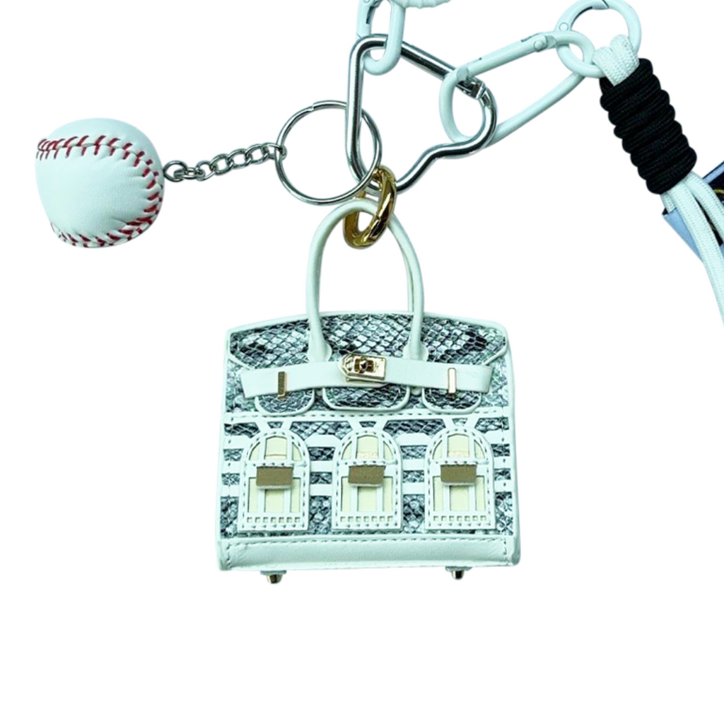 Chrome blue snakeskin leather mini bag charm with keychain shaped like a house, featuring window panels and a top handle.
